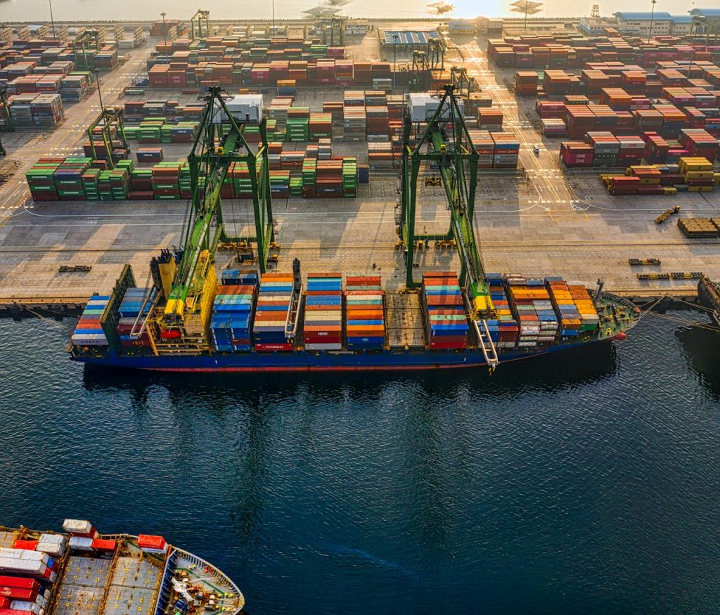 Aerial shot of colorful shipping containers at North Jakartas bustling port, Indonesia.