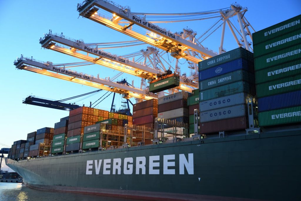 green-and-gray-evergreen-cargo-ship-1117210 An Evergreen container ship loading at the Port of Baltimore during daytime.